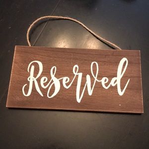 “reserved” rustic sign.